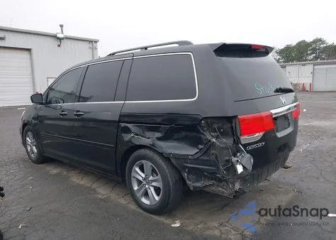 2010 Honda Odyssey Touring z USA, uszkodzony, nr VIN 5FNRL3H96AB049919